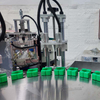 Automatic 2 Station Rotary Perfume Filling Crimping Collaring Machine PLC Touch Screen Perfume Bottle Filling Capping Production Line For Glass Perfume Bottles